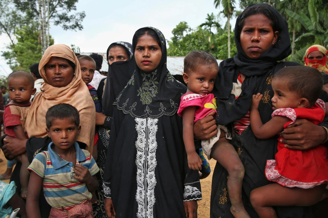 Members of Myanmar's Muslim Rohingya ethnic minority wait to enter the Kutupalong makeshift refugee camp in Cox's Bazar, Bangladesh. (AP)