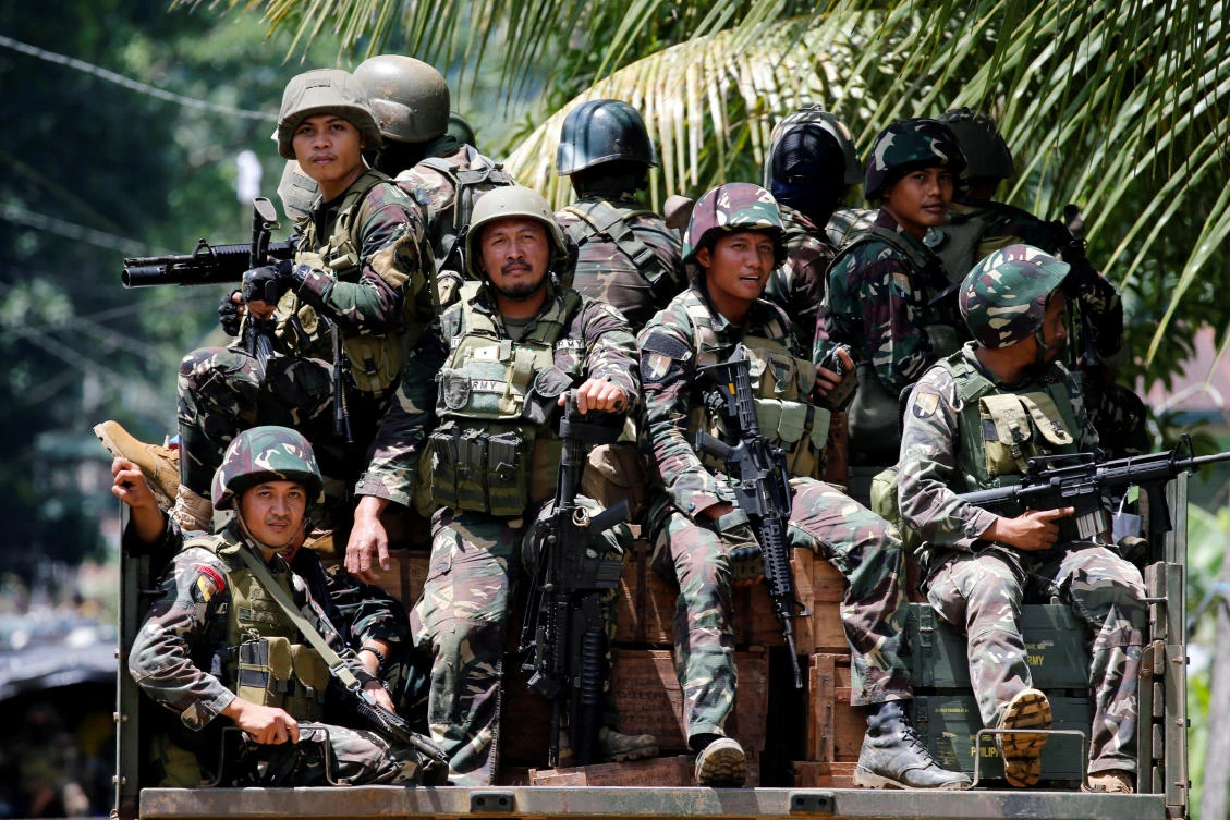 File photo: Philippines army soldiers ride in trucks into the fighting zone as government troops continue their assault against insurgents from the Maute group in Marawi City, Philippines. (Reuters)