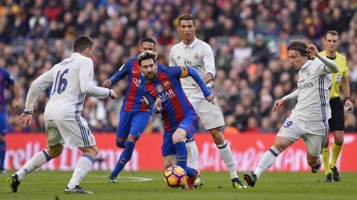 Barcelona’s Leo Messi runs at Real Madrid during El Clasico. (File photo by Reuters)