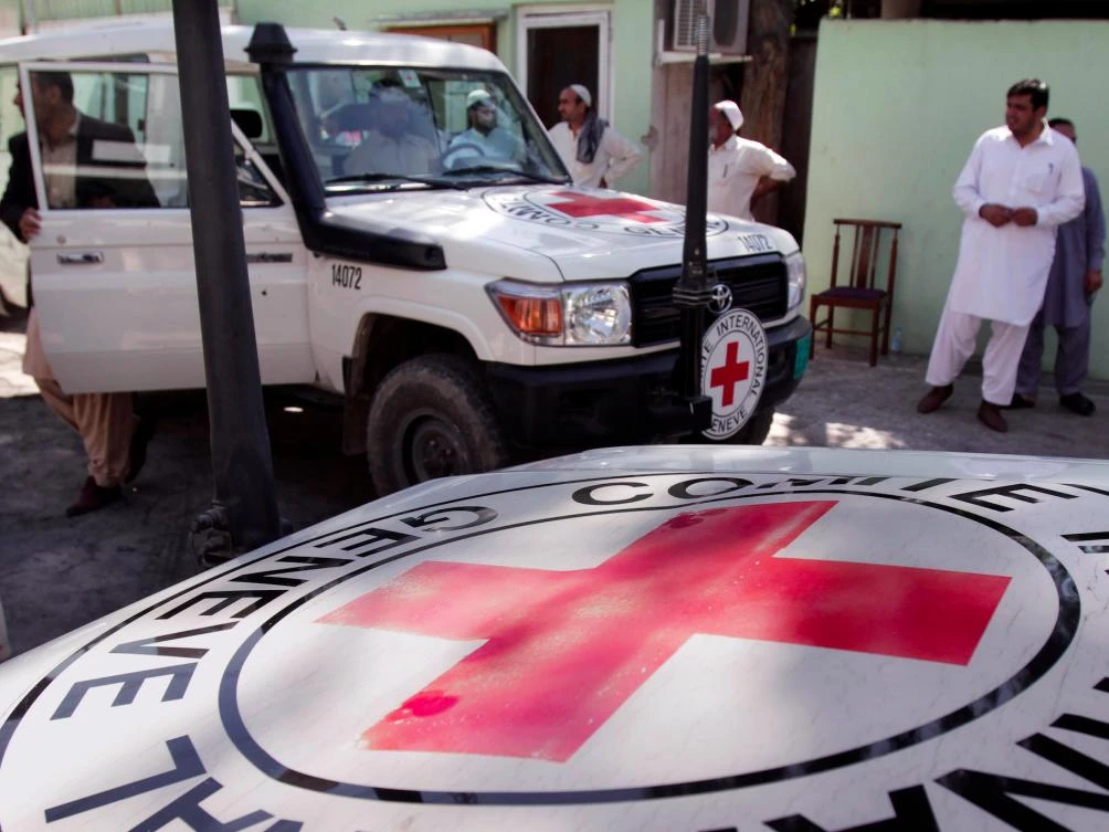 In this file photo, International Red Cross employees are seen during an investigation after the suicide attack and gunbattle at the International Red Cross building, in Jalalabad, Afghanistan, on Thursday, May 30, 2013. (File photo by AP)