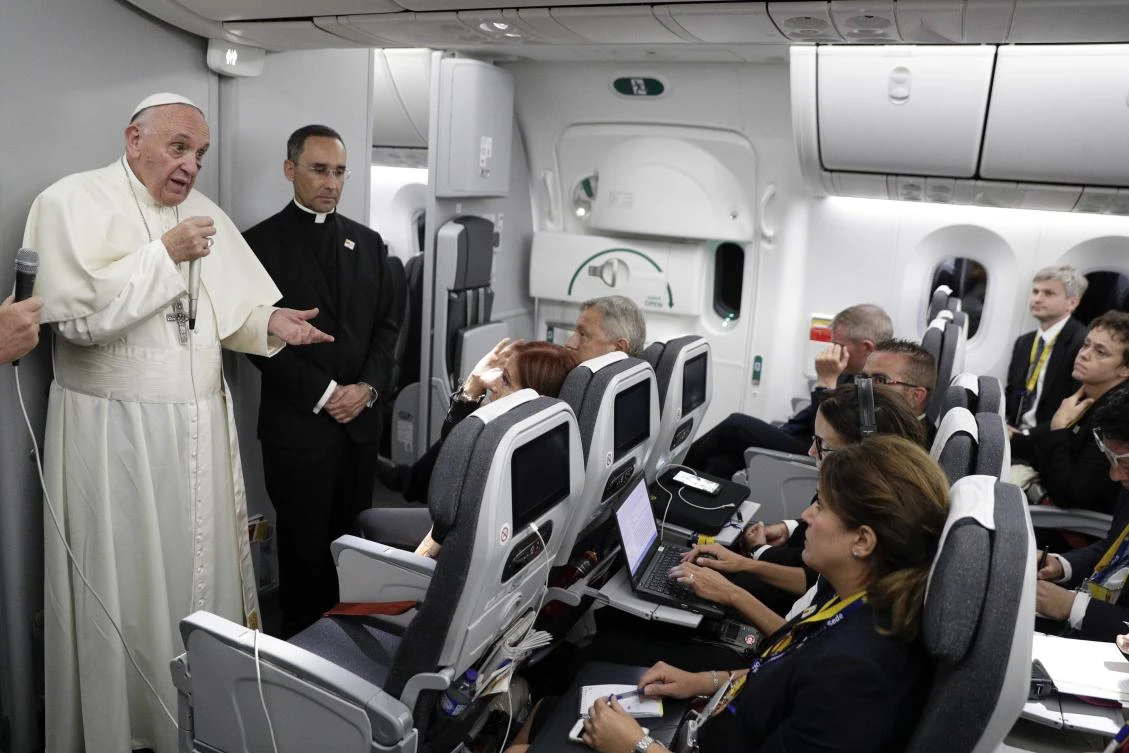 Pope Francis talks to journalists during a press conference held on board the flight to Rome, at the end of a five-day visit to Colombia, on September 11, 2017. (AFP)