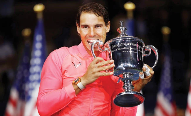 Rafael Nadal, of Spain, holds up the championship trophy after beating Kevin Anderson, of South Africa, in the men’s singles final of the US Open tennis tournament Sunday in New York. (AP)