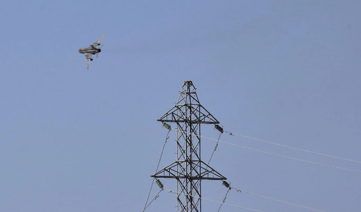 A fighter jet flies over the eastern Syrian city of Deir Ezzor. (AFP)