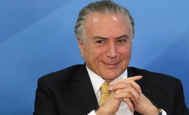 Brazil's President Michel Temer smiles during a meeting with trade unionists at the Planalto Palace in Brasilia, Brazil, on September 12, 2017. (REUTERS/Adriano Machado)