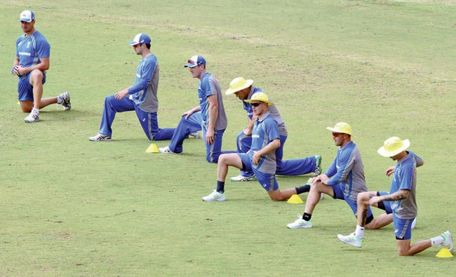 Australian cricket team members warm up during a practice session in Chennai. Australia and India are scheduled to play five one-day international (ODI) and three Twenty20 matches, with the first ODI scheduled to be held Sept. 17 in Chennai. (AP)