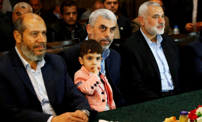 Hamas leader Ismail Haniyeh (R) and Hamas Gaza Chief Yahya Al-Sinwar attend a ceremony announcing a new policy document, in Gaza City, on May 1, 2017. (REUTERS/Mohammed Salem/File Photo)