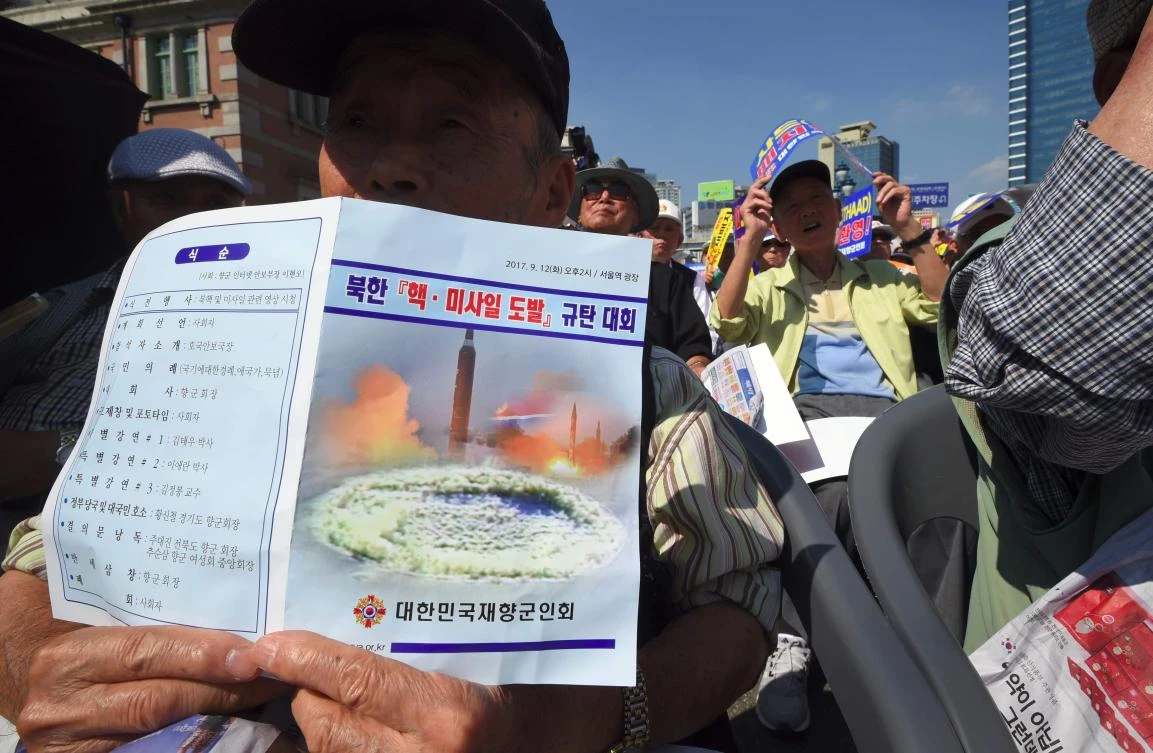 Members of the Korean Veterans Assosiation hold up banners during a rally demanding the re-deployment of US tactical nuclear weapons in South Korea to cope with North Korea's nuclear threat, in Seoul. (AFP)