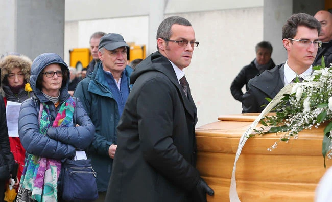 In this Feb. 12, 2016 file photo, the family of Giulio Regeni follows his coffin during the funeral service in Fiumicello, Northern Italy. Regeni was killed under suspicious circumstances during a police crackdown in Cairo. The issue has come to the fore once again after Egyptian prosecutors ordered the detention for 15 days of lawyer Ibrahim Metwally, who assisted the family of Regeni, accusing him of disseminating false news. (AP Photo/Paolo Giovannini, File)
