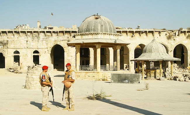 Two Russian military police officers guard in the yard of Aleppo's oldest Umayyad mosque, Syria, on Tuesday. (AP)
