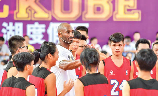 Former NBA basketball player Kobe Bryant attends a basketball teaching activity in Haikou in China's southern Hainan province on Wednesday. (AFP)
