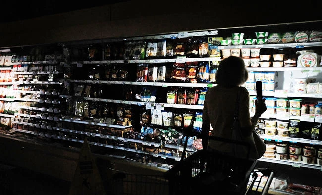 People shop in a supermarket, one of the few open, with limited electricity three days after Hurricane Irma swept through the area on Wednesday in Naples, Florida. (AFP)