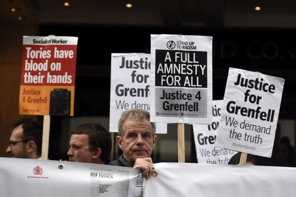 Demonstrators gather outside the Grenfell Tower public Inquiry in central London, Britain, September 14, 2017. (REUTERS)