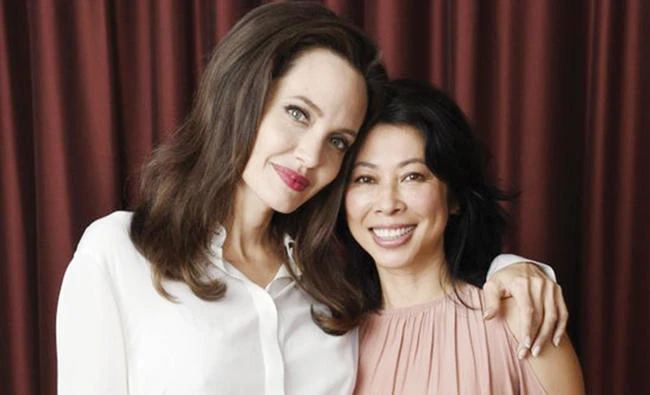 Angelina Jolie, left, and Loung Ung pose for a portrait during the Toronto International Film Festival in Toronto. (AP)