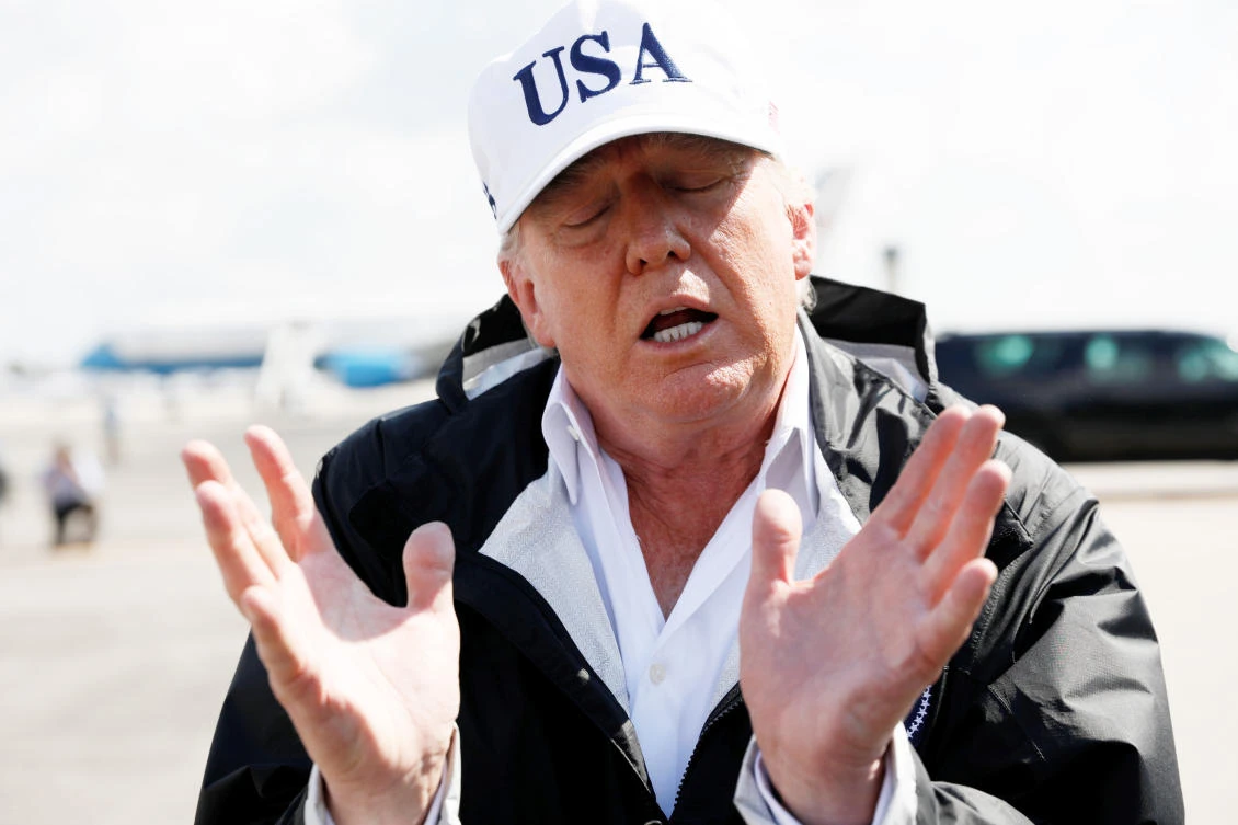 US President Donald Trump talks to the media after arriving to receive a briefing on Hurricane Irma relief efforts in Fort Myers, Florida, on Thursday. (Reuters)