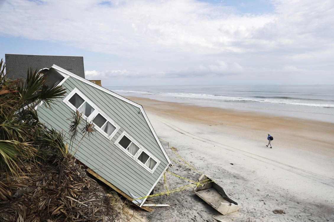 A house rests on the beach after collapsing off a cliff from Hurricane Irma in Vilano Beach, Fla., Friday. (AP)
