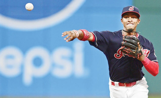 Cleveland Indians’ Francisco Lindor throws to first after getting out Kansas City Royals’ Alcides Escobar in the seventh inning of a baseball game in Cleveland on Thursday. (AP)