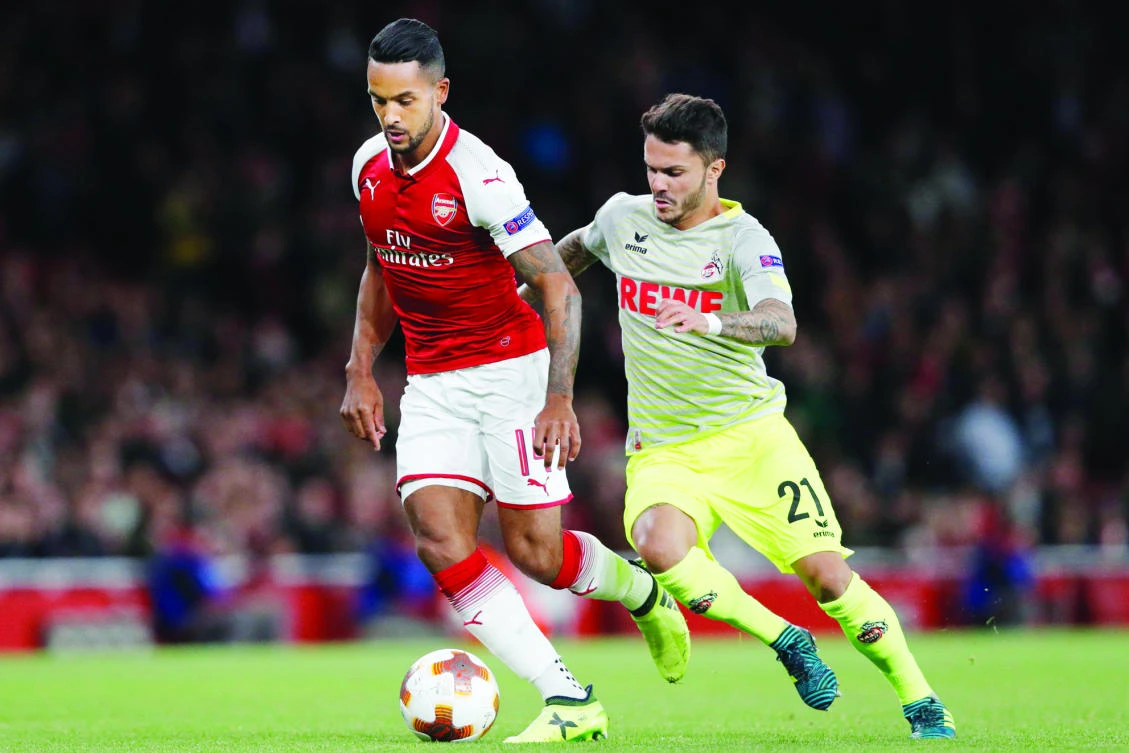 Arsenal’s English midfielder Theo Walcott, left, vies with FC Cologne’s German midfielder Leonardo Bittencourt during the UEFA Europa League Group H football match between Arsenal and FC Cologne in London on Thursday. (AFP)