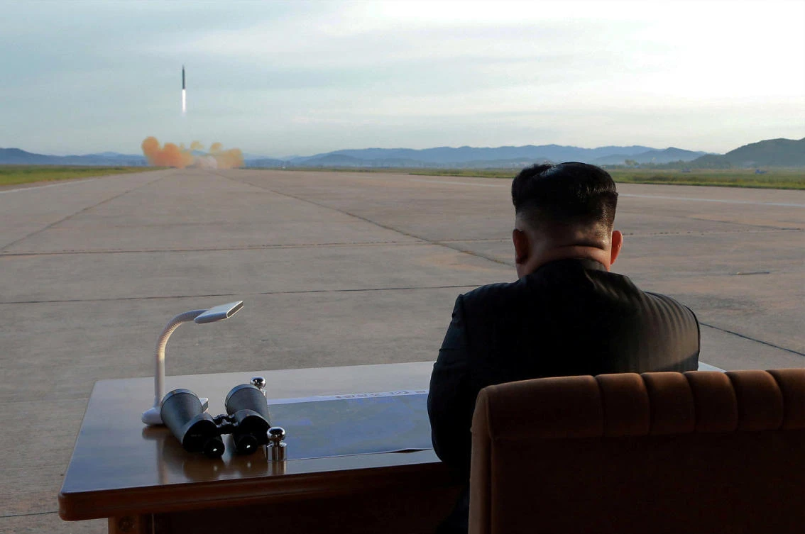 North Korean leader Kim Jong Un watches the launch of a Hwasong-12 missile in this undated photo released by North Korea’s KCNA. (Reuters)