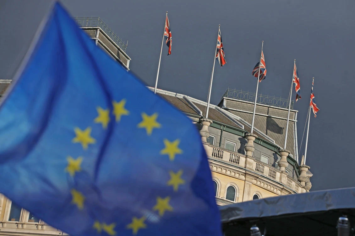Protesters wave European flags in Trafalgar square during a rally in central London to warn about the terms of Brexit, by EU nationals in Britain and UK nationals in Europe, on September 13, 2017. (File photo by AFP)