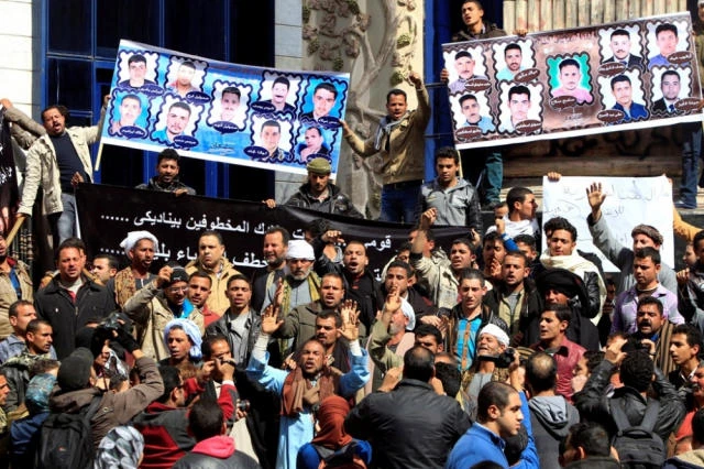 Relatives of 27 Egyptian Coptic Christian workers who were kidnapped in the Libyan city of Sirte, take part in a protest to call for their release, in Cairo, February 13, 2015. (File photo by Reuters)
