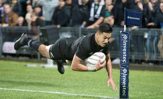 New Zealand’s winger Rieko Ioane scores a try against South Africa during their Rugby Championship match in Auckland Saturday. The All Blacks defeated the Springboks 57-0. (AP)