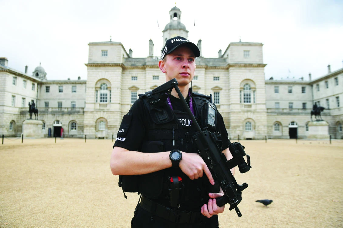 A police officer stands guard outside the Horse Guards Parade in London. Police arrested an 18-year-old man on Saturday in connection to their investigation into Friday’s bombing on an Underground train. (AFP)