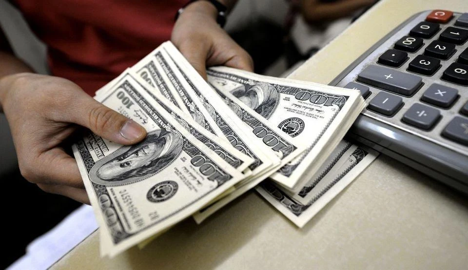 Tahir Salim Al-Amri said his country remained committed to the rial’s currency peg against the US dollar. (Reuters)