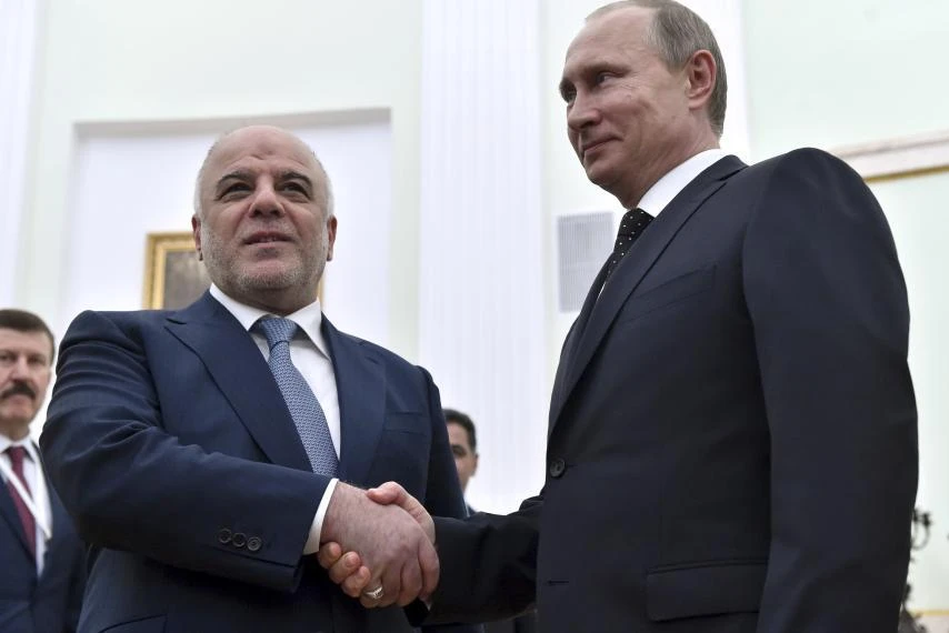 Russian President Vladimir Putin (R) shakes hands with Iraqi Prime Minister Haider al-Abadi during their meeting at the Kremlin in Moscow, Russia, May 21, 2015. (File photo by REUTERS)