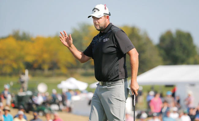 Marc Leishman acknowledges the crowd after making birdie on the 13th hole during the third round of the BMW Championship golf tournament at Conway Farms Golf Club Saturday in Lake Forest, Ill. (AP)