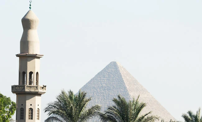 A minaret of mosque is seen in front of the Giza pyramids area, on the outskirts of Cairo, Egypt, in this September 10, 2017 photo. (REUTERS)