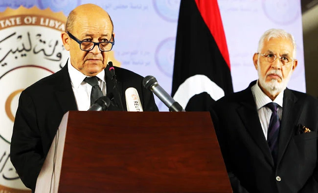 French Foreign Affairs Minister Jean-Yves Le Drian gives a joint press conference with his Libyan counterpart Mohamed Taha Siala (R) following his arrival at the Prime Minister's headquarters in the Libyan capital Tripoli, in this September 4, 2017 photo. (AFP)