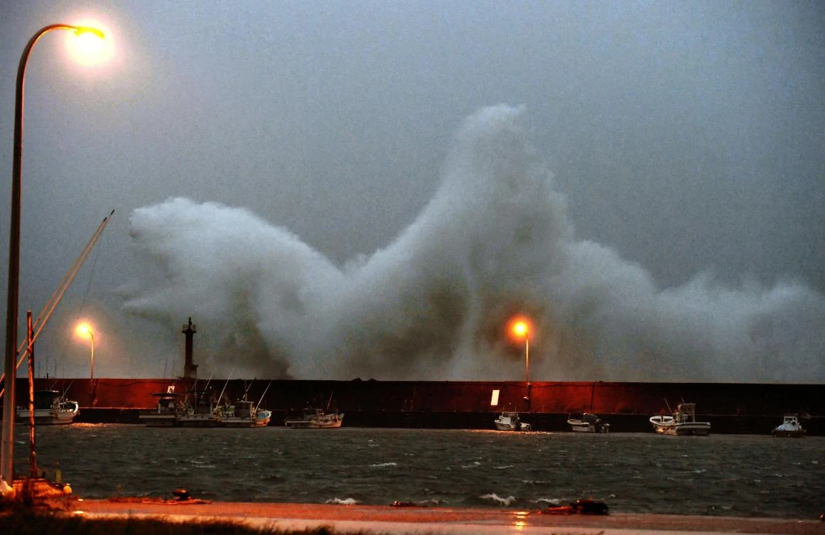 High wave hits a breakwater in Aki city, Kochi prefecture as a typhoon approaches the area, Sunday, Sept. 17, 2017. (Muneyoshi Someya/Kyodo News via AP)