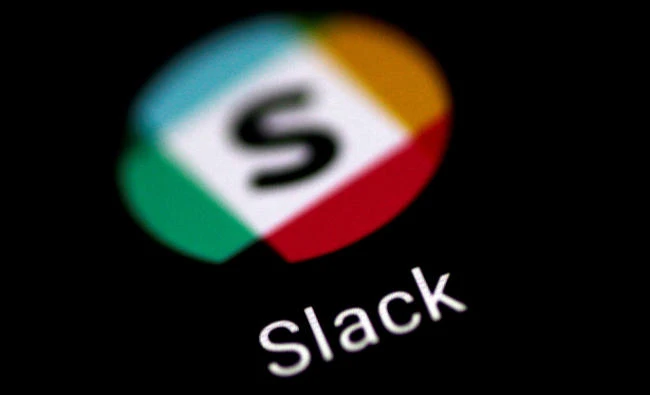 The Slack messaging application is seen on a phone screen. (Reuters)