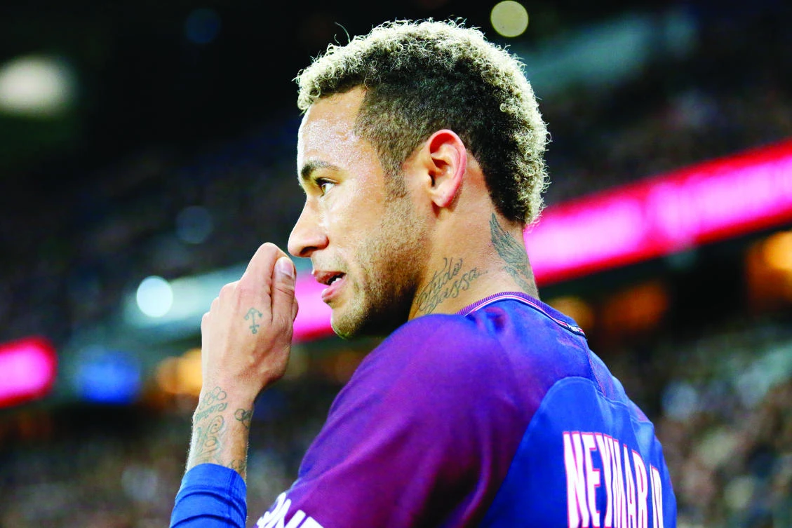 Paris Saint Germain’s Neymar looks on during their French League One soccer match between PSG and Olympique Lyon at the Parc des Princes stadium in Paris Sunday. (AP)