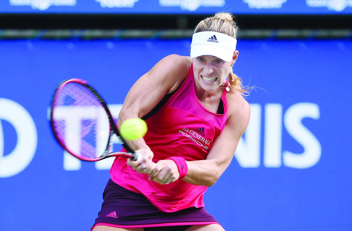 Angelique Kerber of Germany returns a shot to Naomi Osaka of Japan Monday during the first round match of the Pan Pacific Open tennis tournament in Tokyo. (AFP)