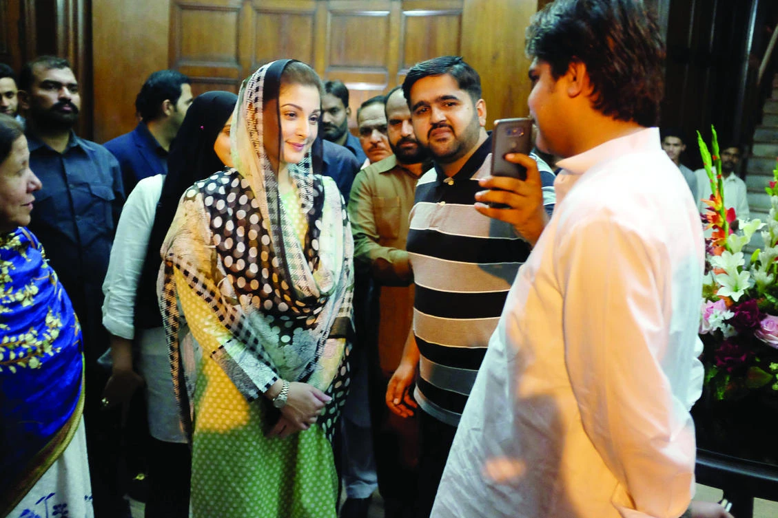 Maryam Nawaz, daughter of Pakistan’s former Prime Minister Nawaz Sharif, takes a picture with a supporter at a rally in Lahore recently. (Reuters)