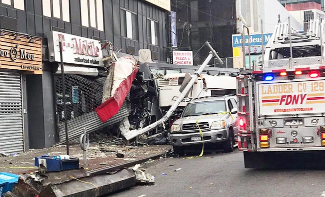 General view of the scene following the collision of a New York City transit bus and a Dahlia tour bus in the city's borough of Queens, New York, U.S., on Monday, in this photo obtained from social media. (Reuters)