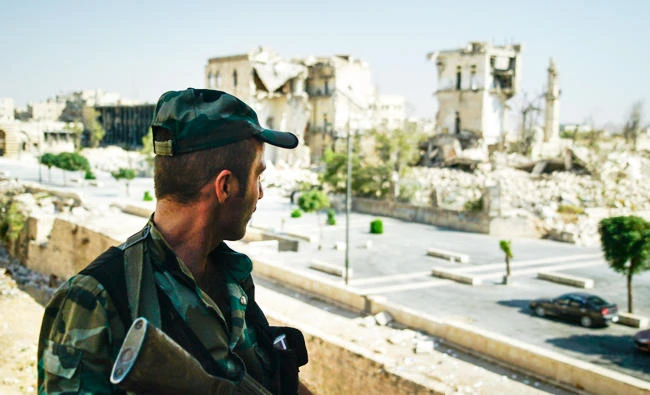 A Syrian soldier guards streets in Aleppo, Syria, in this Sept. 12, 2017 photo. (AP)