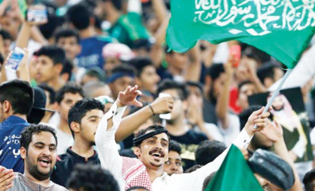 File photo shows ecstatic Saudi football fans during the Asian World Cup qualifying match between Japan and Saudi Arabia on Sept. 5. (Reuters)