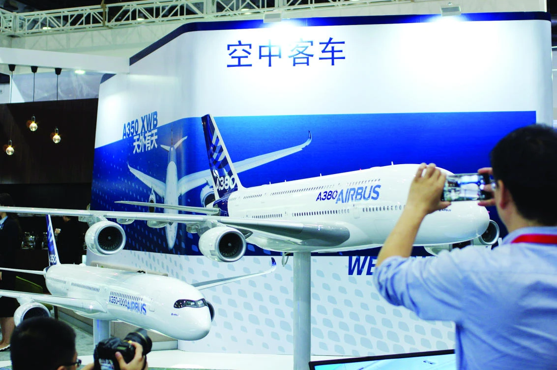 A visitor takes a photo of a model of an Airbus A380 plane at Aviation Expo China
2017 in Beijing. Chinese airlines could buy as many as 100 of the planes over the next
five years. (Reuters)
