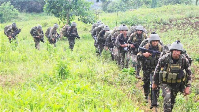 Philippine soldiers on patrol during an operation against Daesh-linked militants at a remote village in Butig town, Lanao del Sur province in this file photo. (AFP)