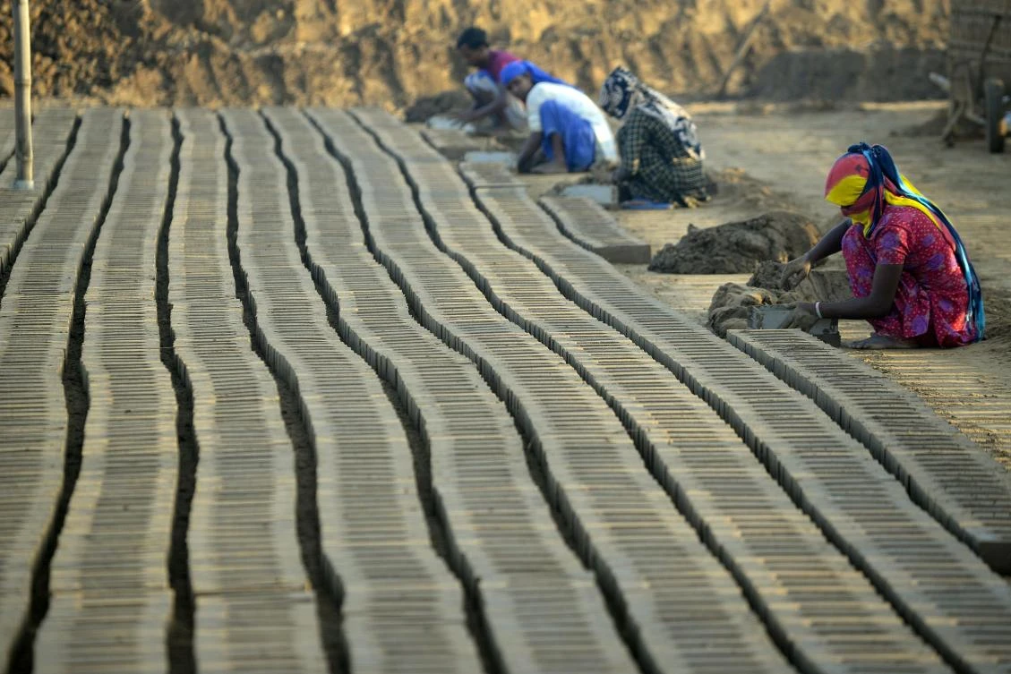 Indian labourers working in a brick kiln on the outskirts of Jalandhar. (AFP)