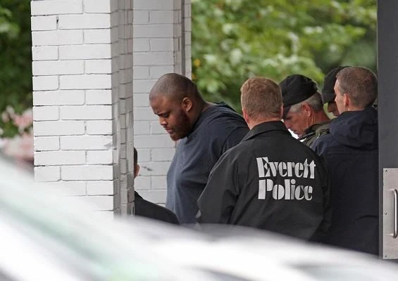 Authorities remove David Wright from 208 Linden St. in Everett after an all day police investigation at the property on Tuesday, June 2, 2015. (Photo courtesy: social media)