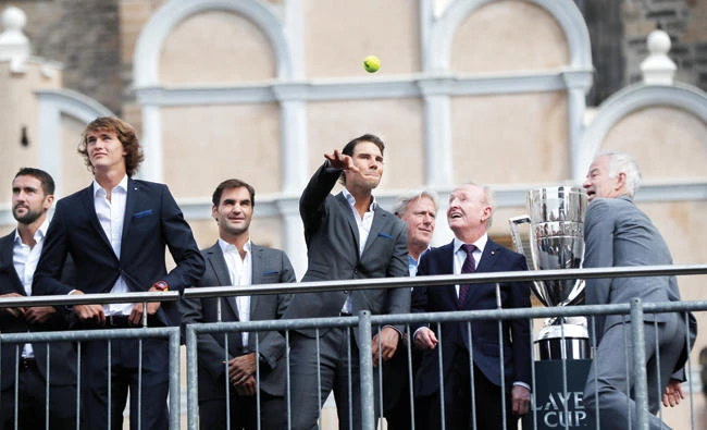 Spain's tennis player Rafael Nadal, center, throws a ball to fans during a welcome ceremony of the Laver Cup at the Old Town square in Prague, Czech Republic, Wednesday. (AP)