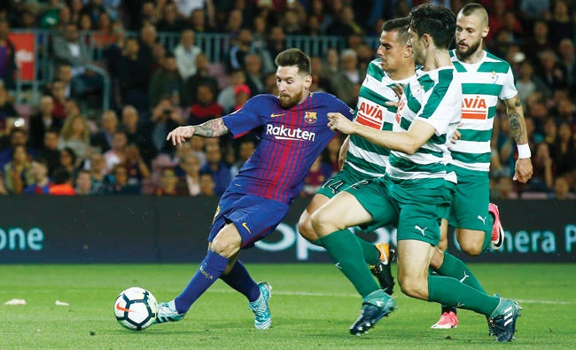 FC Barcelonas Lionel Messi kicks the ball to score during the Spanish La Liga soccer match between FC Barcelona and Eibar at the Camp Nou stadium in Barcelona, Spain, Tuesday. (AP)