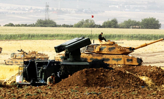 Turkish armoured military vehicles are seen during a military exercise near the Turkish-Iraqi border in Silopi, Turkey, on Wednesday. (REUTERS)