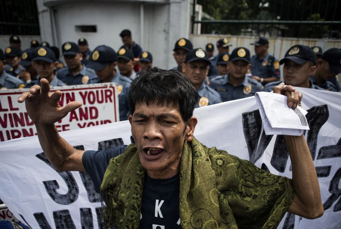 An activist shouts slogans during a protest against Philippine President Rodrigo Duterte in Manila on September 21, 2017. (AFP)