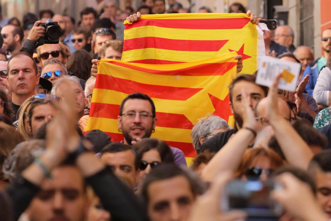Protesters hold Esteladas — Catalan separatist flags — during a rally in Madrid. (Reuters)