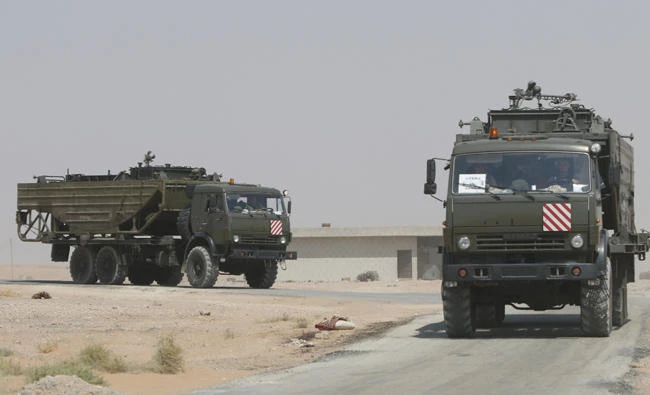 Russian trucks seen on the road heading to Deir al-Zor in Kabakeb, Syria, on September 21, 2017. (REUTERS/Omar Sanadiki)