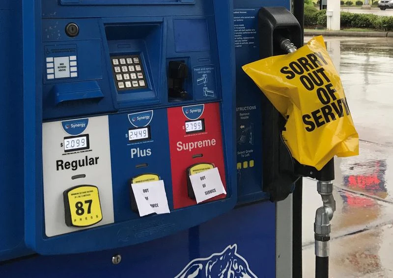 Above, a gas pump is covered with an out of service message as fuel ran out ahead of Hurricane Harvey's arrival near the Texas coastal area, in Houston, Texas. (Reuters)